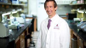 John Crispino, Ph.D., of St. Jude Children’s Research Hospital, stands for a photo in a laboratory.